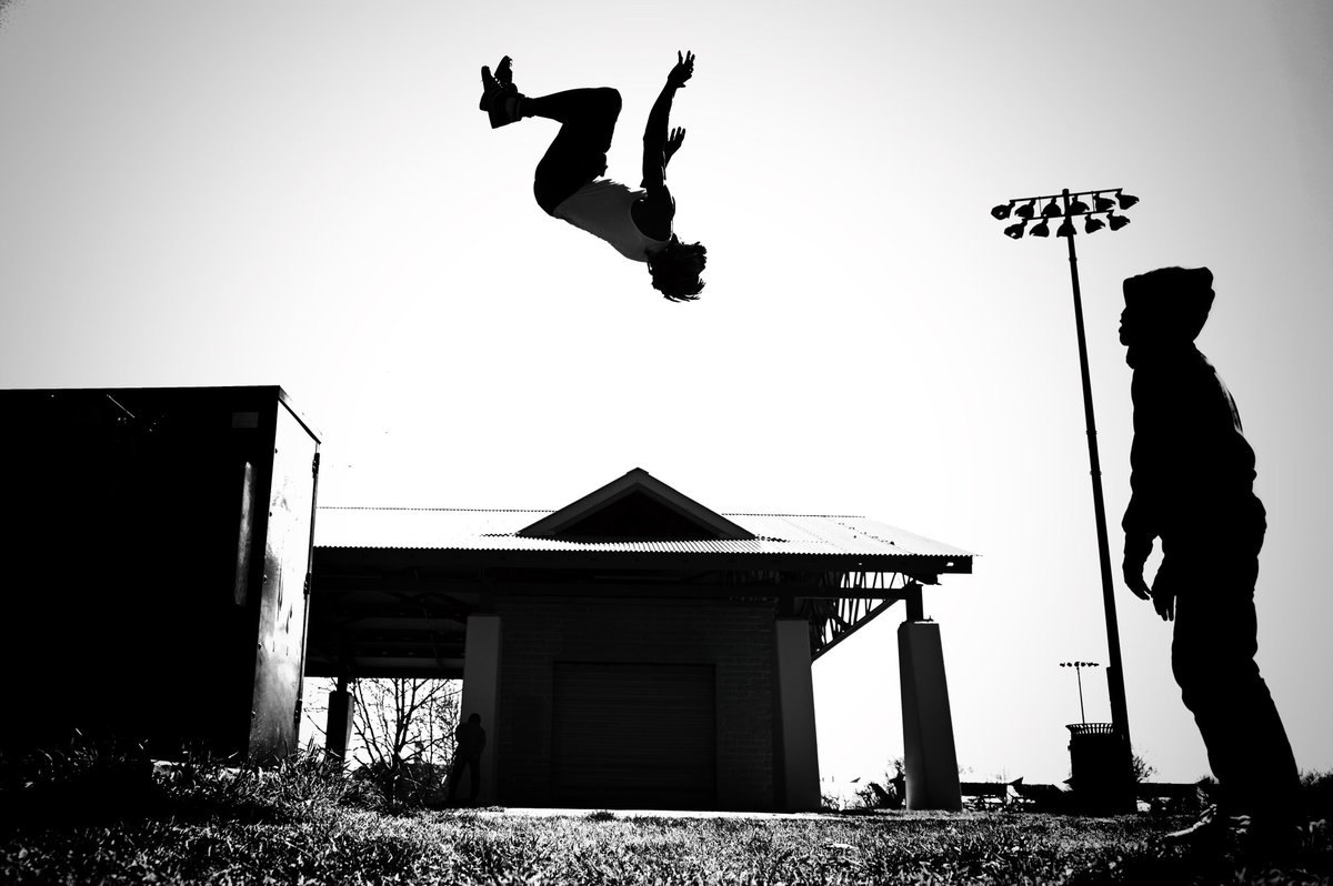 Ronnie Brown takes to the air during a backflip at Carroll Park in #Baltimore.
#bnw #streetphotography