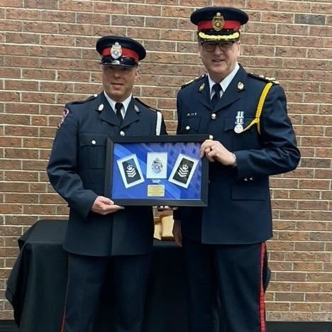 Estevan_Police's tweet photo. Congratulations to newly promoted Sergeant Braden Lonsberry!  Sgt Lonsberry was presented with a commemorative shadowbox to honour his promotion by Chief Lowen at the Estevan Board of Police Commissioners meeting. https://t.co/bxRJGmjDRj