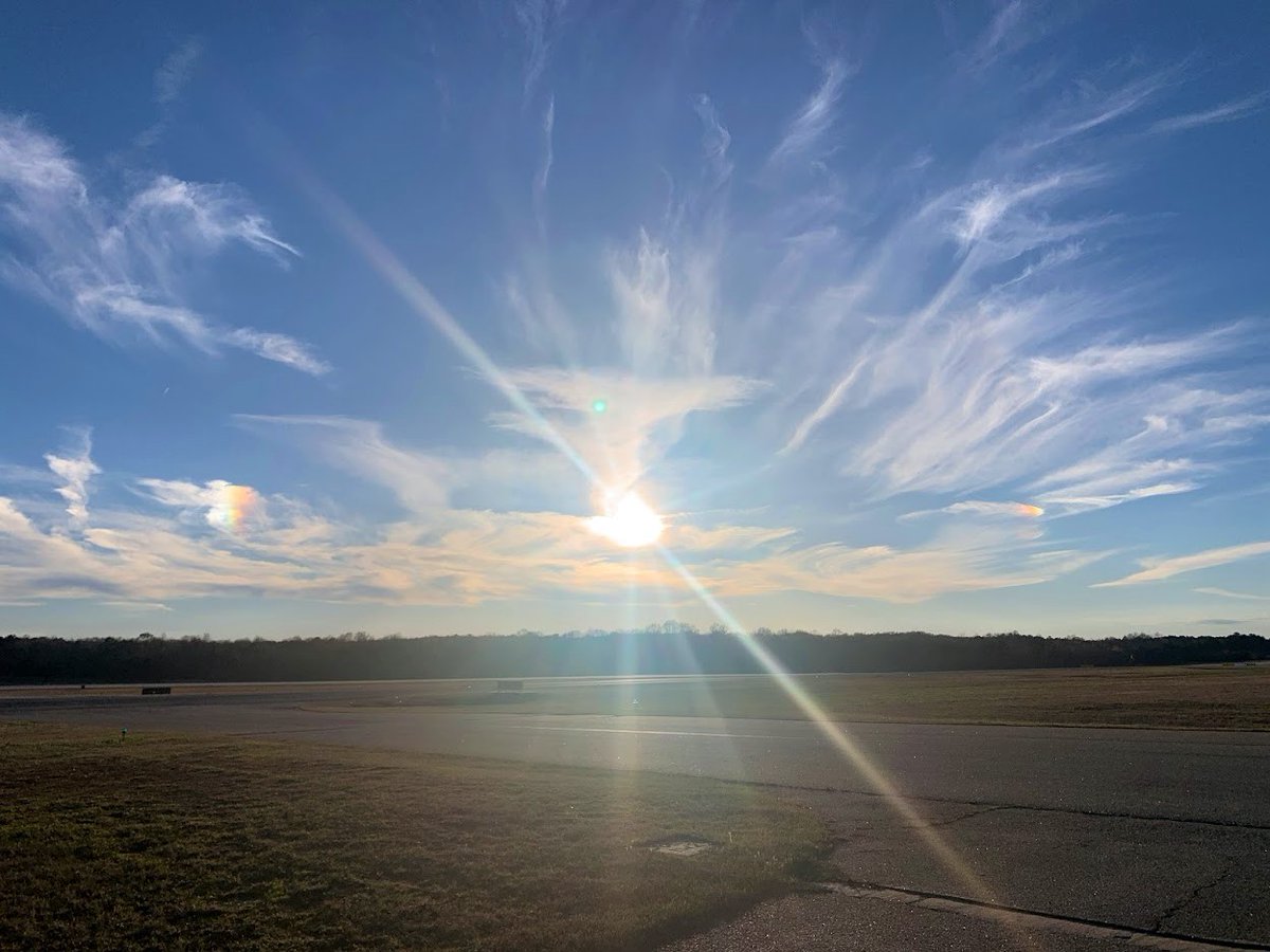 NWSAtlanta's tweet photo. Can you spot the S U N D O G S ? Sundogs are bite-size rainbow patches of light that form when the sun, low on the horizon, reflects light through ice particles in high clouds. Sundogs can signal approaching bad weather as cirrus &amp; cirrostratus move in ahead of a system. #gawx https://t.co/CjIHDCvxqe