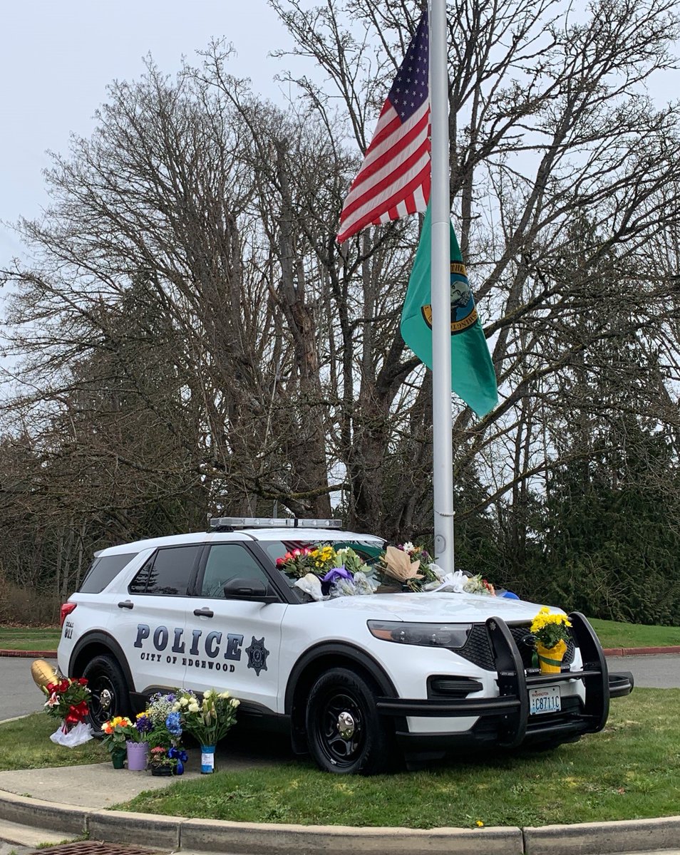 Edgewood_PD's tweet photo. We have set up a memorial with Deputy Calata's patrol vehicle in front of Edgewood city hall to honor him.  We appreciate the thoughtful notes and the beautiful flowers that have already been left.  We'll be collecting these items for his family.  
#TeamEdgewood https://t.co/aqis00NNrV