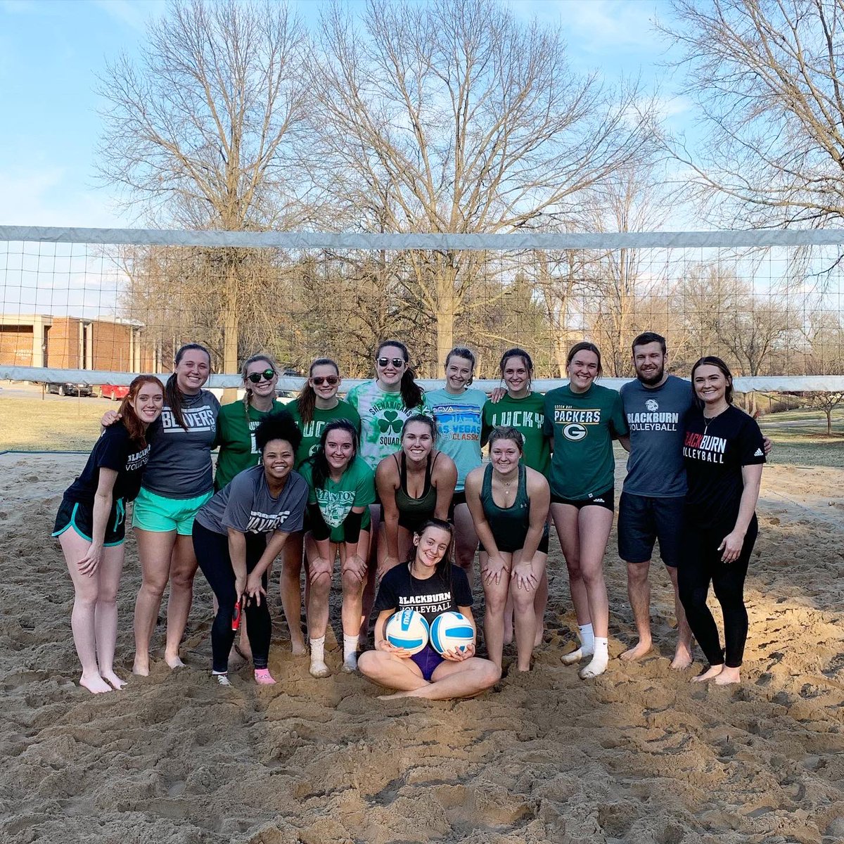 blackburn_vb's tweet photo. Beautiful day for a sand practice!  ☀️🏐 

We celebrated St. Patrick’s Day by swapping out our red &amp; black for green today. 🍀

Shoutout to our awesome alums for stopping by and getting back on the court with us (even if they didn’t get the “green” memo).❤️🖤 https://t.co/ks5kvHZIaD