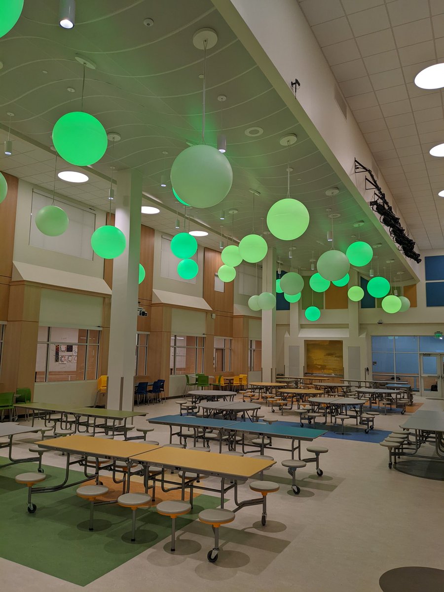 Happy St. Patrick's Day. This is our cafeteria, one of the most functional and calming places I've seen in any school. All of the lights can change different colors to help, "set the mood". Our kids are so lucky to have this space to eat every day.