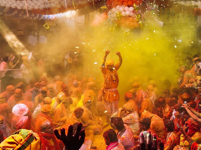 People from the cities of Nandgaon and Barsana sit in the courtyard of a temple and sing songs in the praise of Lord Krishna. Shot at Radha Rani temple, Barsana.