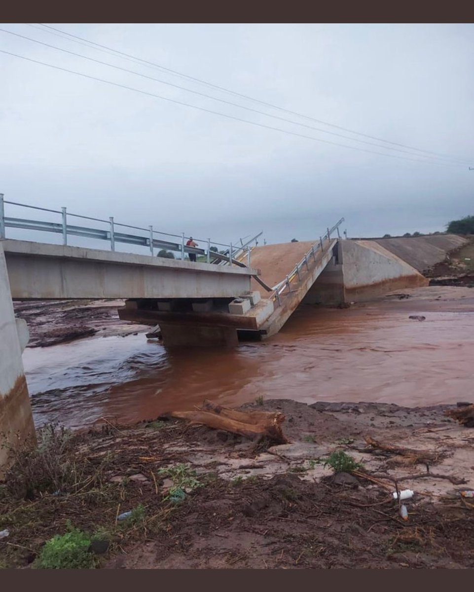 ahmednasirlaw's tweet photo. God works miracles...in this dry and hot season he sends rain for one day and for specific purpose...to show the world that the bridge built by Gov Ole Lenku and County Government of Kajiado at Sh 110 m ($ 1 million) was a fraud on the people...and God destroyed it... https://t.co/wbEL2bFQi8