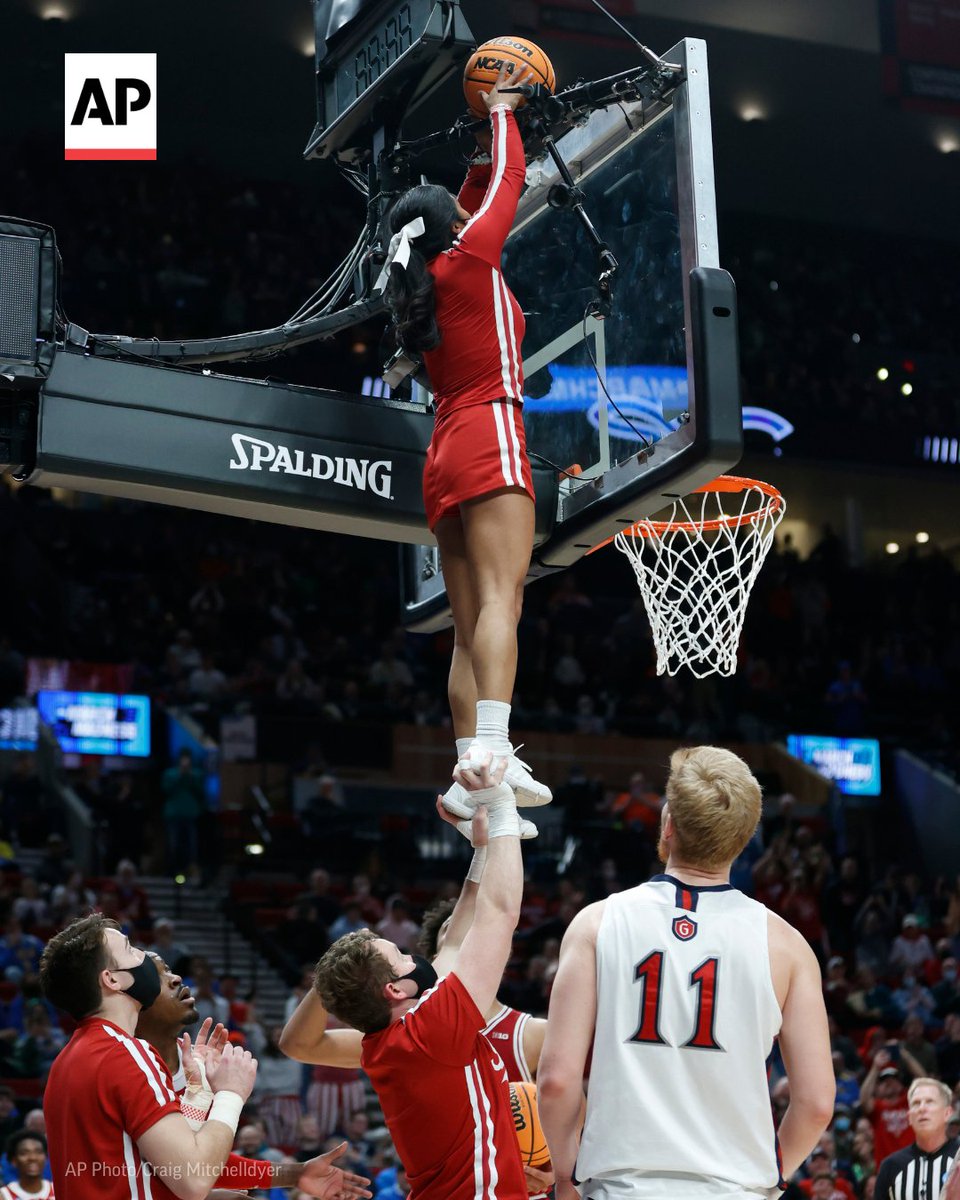 AP's tweet image. When the ball got stuck between the backboard and the shot clock during the second half of a NCAA college basketball tournament game between St. Mary's and Indiana, the players tried with no success to get it free.

Enter Indiana’s resourceful cheer squad. apne.ws/g9UbVYr