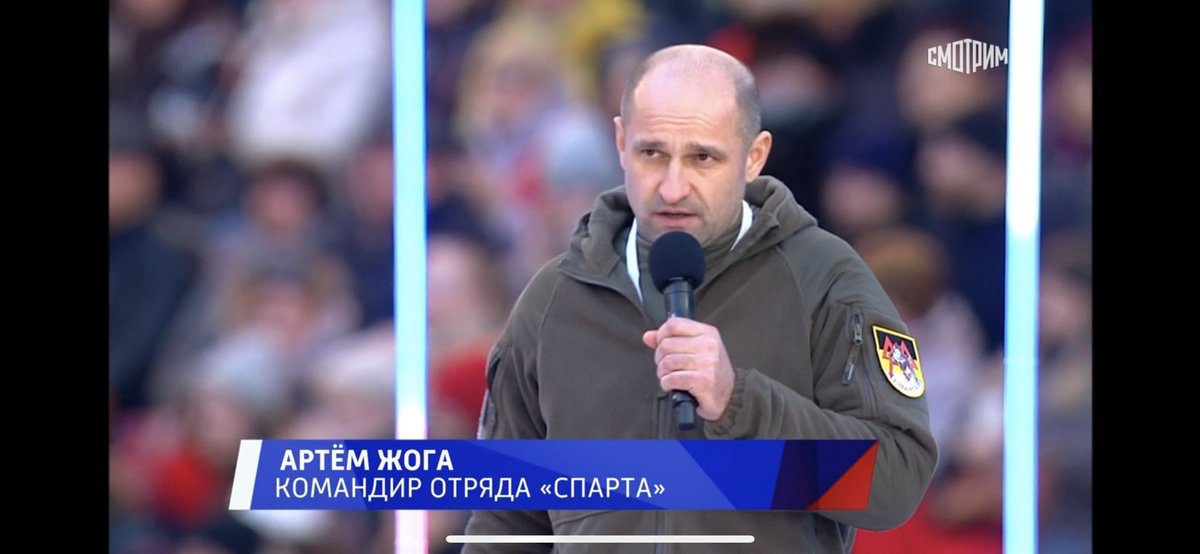 Dmitry Guberniev is best known as Russia’s unbelievably positive, hyperactive TV biathlon commentator. Now here he is introducing the leader of a Donbas separatist battalion