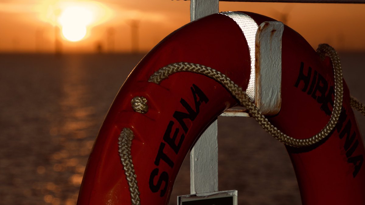WixpixRob's tweet photo. The lights of Blackpool tower ahead, but at least another 60 minutes on board.
A couple as the sun set through the #WalneyWindFarm off the Cumbrian coast.
And through the ‘life buoy’ of the @StenaLine #Hibernia 😎
Mustn’t grumble eh 🤷♂️
📸WixPix@Sea https://t.co/fCKId2yGkH