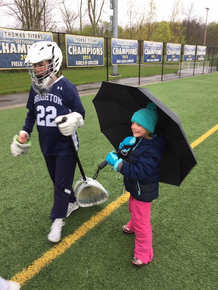 MuddysBuddies's tweet photo. Not even a little rain can block that ray of sunshine. ☀️🥍🐻💙 Brighton girls lacrosse is fired up to welcome you back. See you tomorrow. #TeamWilla #DIFW https://t.co/TeKmvfwYIW