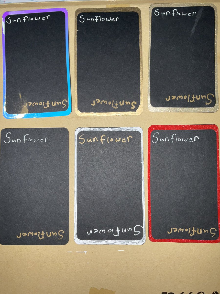 Chibiyato1's tweet photo. The second gold one on the top right is a glitter gold the red one right under it is as well, also which color do you guys think? Gold or white for the lettering. There will also be sunflower die cut stickers and stickers sheets once my printer is fixed. https://t.co/Qx6sSHauXt