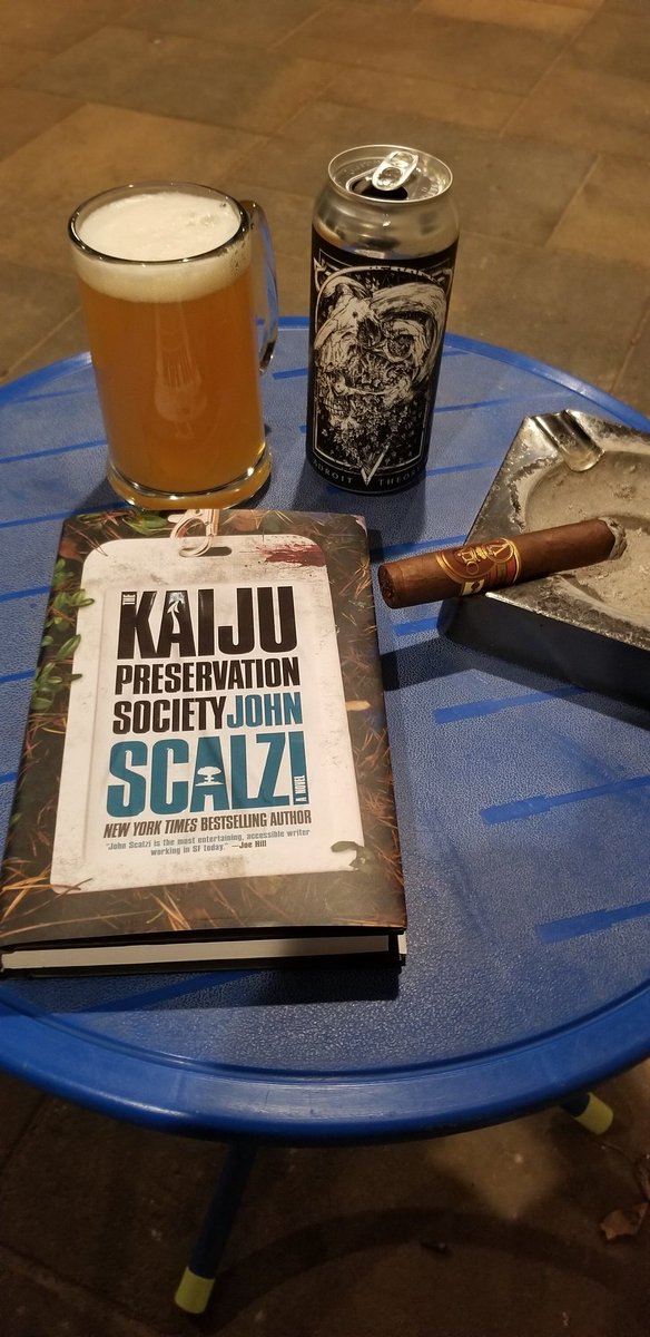 DrewT725's tweet photo. #OnTheBlueTable this evening with; @OlivaCigar Serie V Maduro Double Robusto, @AdroitTheory Brewing's Evangelion V. Ramiel (Ghost 1134) Triple IPA, and (just escaped this week!) The Kaiju Preservation Society by @scalzi https://t.co/5AwypCPlmK