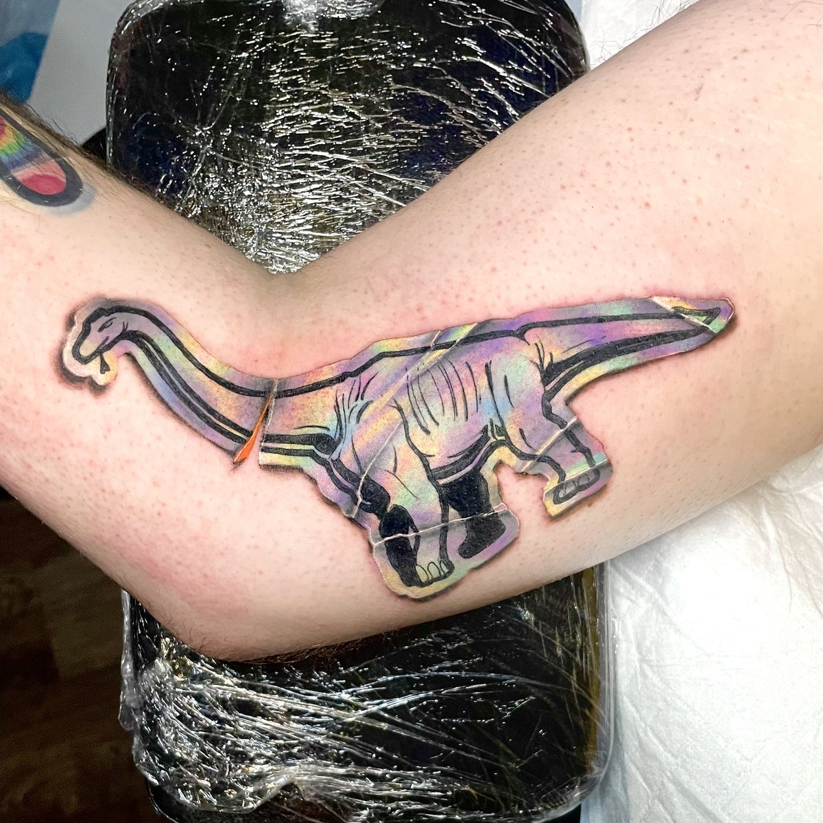 #dinosaur #stickertattoo #flipshadestattourist #longlivetattoocollective #flipshades #holographicsticker