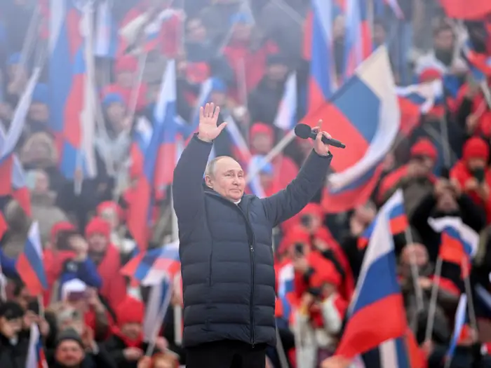 TheOtherView2's tweet photo. Putin is scared. I'm guessing he's got body armor on from head to toe here. Either that or the stadium hadn't paid their heating bill! #PutinIsaWarCriminal #putinrally https://t.co/AqBSSANJ5w