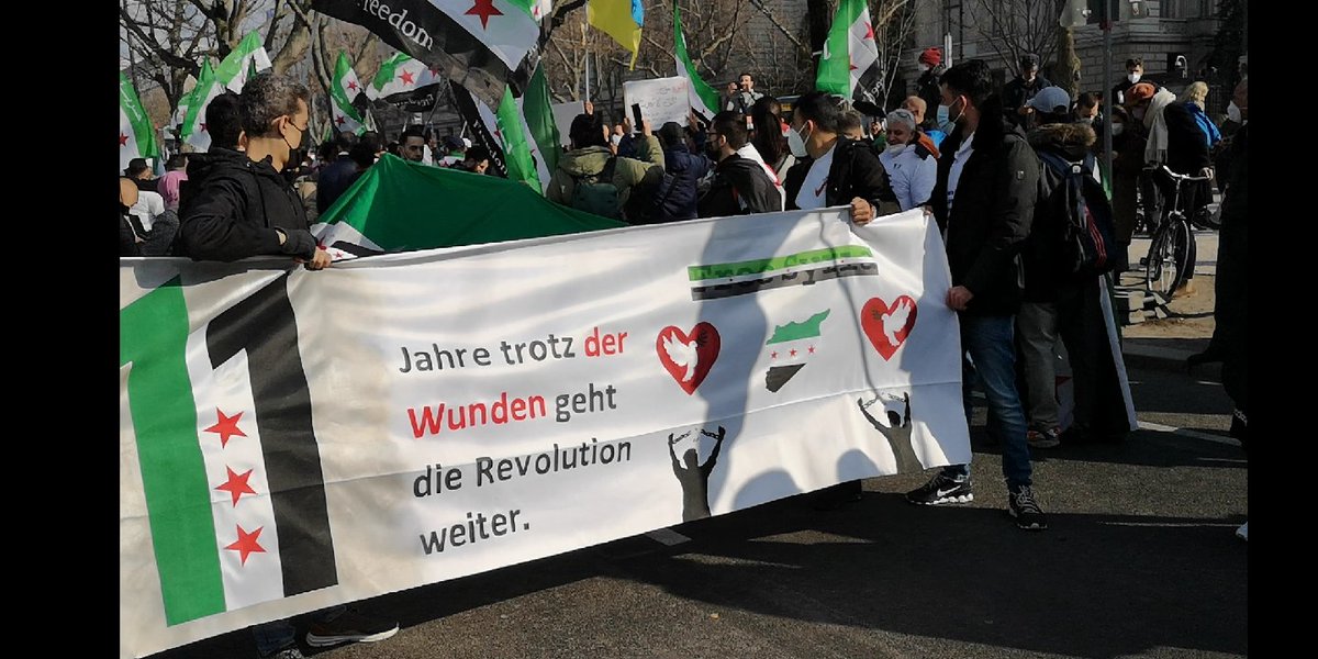Osmannarfat's tweet photo. A demonstration in #Berlin today 19.03.2022 in front of the Russian embassy, on the eleventh anniversary of the Syrian revolution.
#StopPutin #StopAssad https://t.co/Jl8vKm6yff