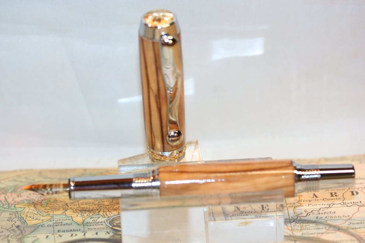 WitmerEnterpr's tweet photo. Sharing the latest addition to my #etsy shop: Fountain Pen - Triton Fountain Pen - Holy Land Olive Wood - Writing - Executive Pen - Handmade - Wood Pen - Chrome with 24K Gold Accents https://t.co/l6dfSeZeCO #pen #gifts #fountainpen #holylandolivewood #WoodPen #handmade https://t.co/Yf1uMOfI61