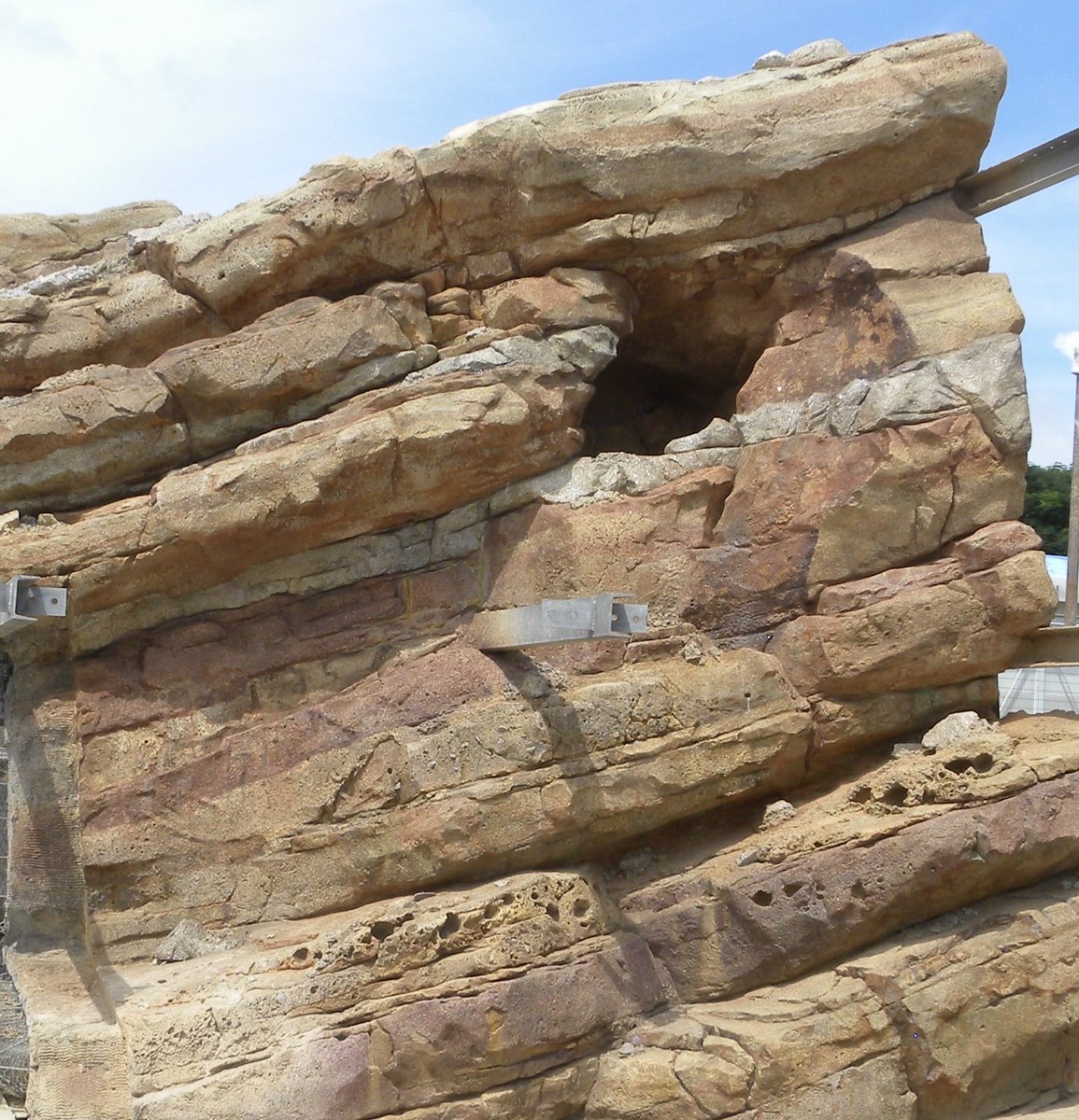 JimShull's tweet photo. Image of rock work with the support steel. This steel will be cut and the holes patched and retouched with paint. This construction method allows worker access to all parts during the work phases. #constructionmethod #steelconstruction https://t.co/Dxo7XkYL0J
