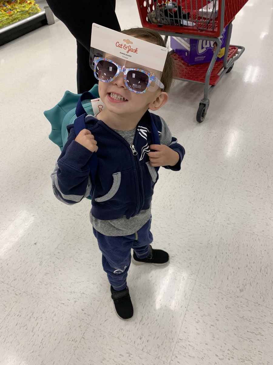 My mini-me with his dino glasses and dino backpack.
