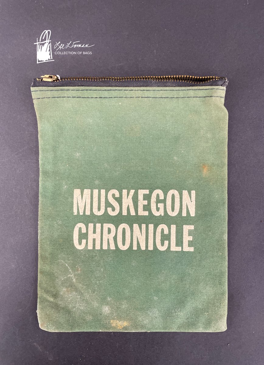 82/365: The Muskegon Chronicle is a daily newspaper in Muskegon, Michigan that has been in publication since 1857. This green canvas bag was originally used by paper carriers to collect money on their routes. The reverse side includes a belt loop.