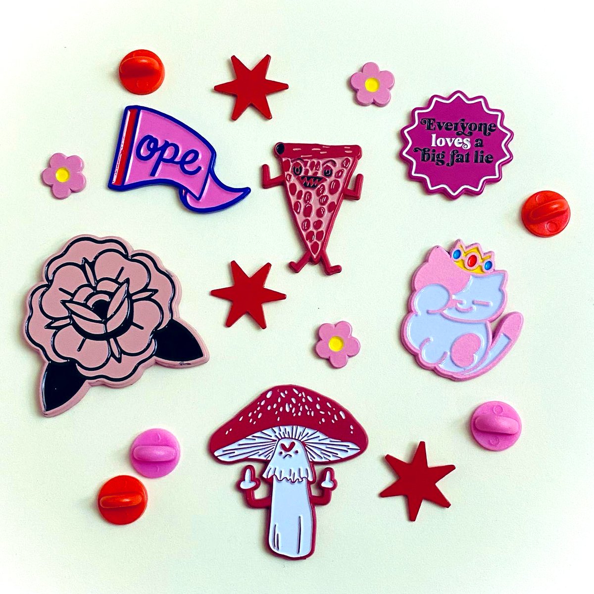 A cute lil mini collection of pins. 

Ope, pizza, flowers and stars all by me 🥰 lilboatboutique.com #enamelpins