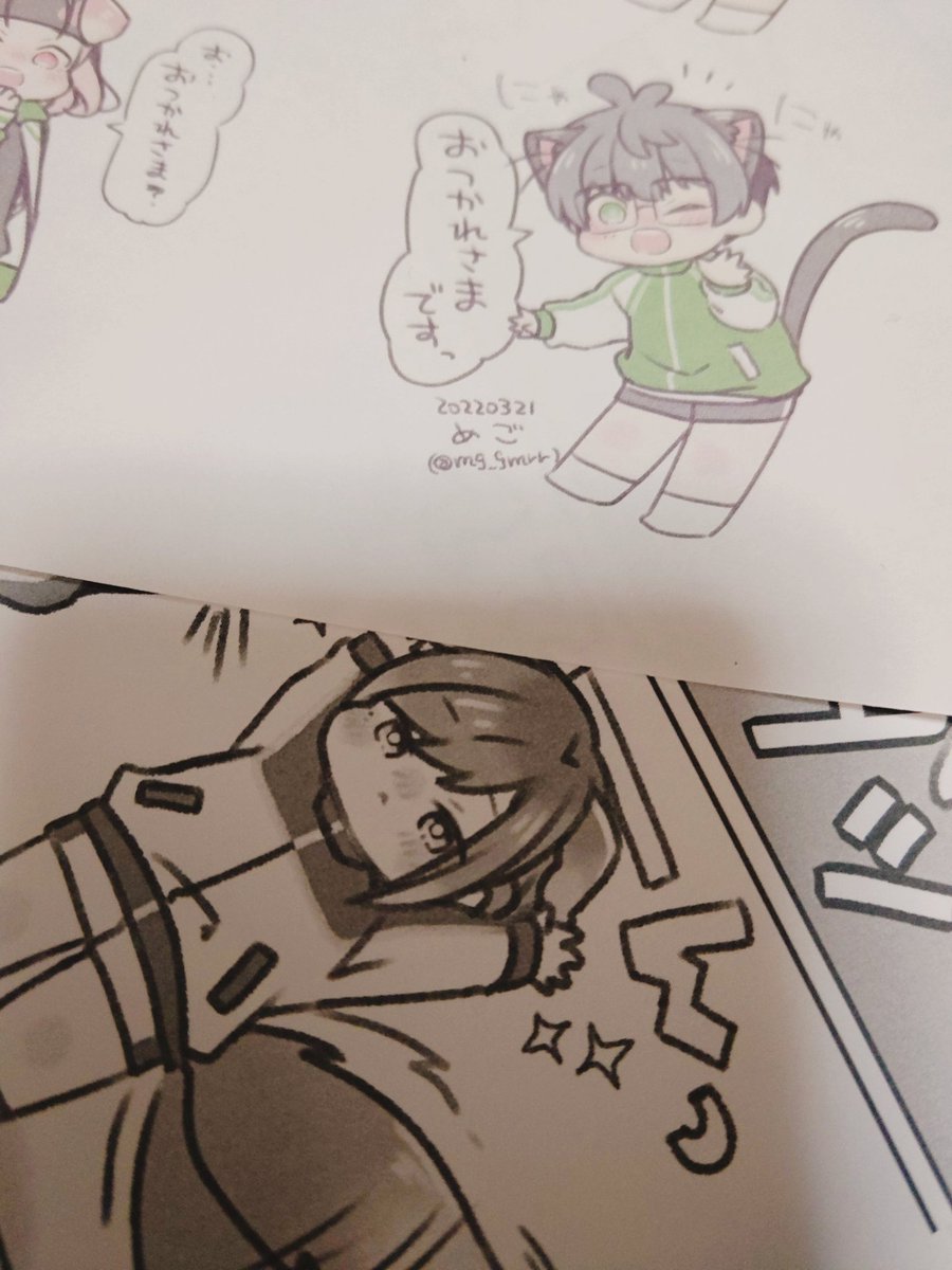 差し入れにねこてたちを貼っていく 