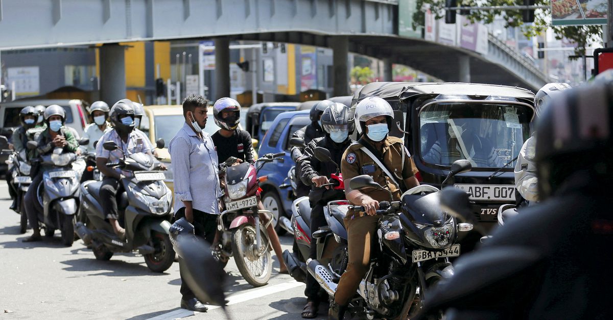 Reuters's tweet photo. In Sri Lanka, as economic crisis worsens, two men die waiting in queue for fuel https://t.co/dr9pmN6g2X https://t.co/MtCdX7OOBo