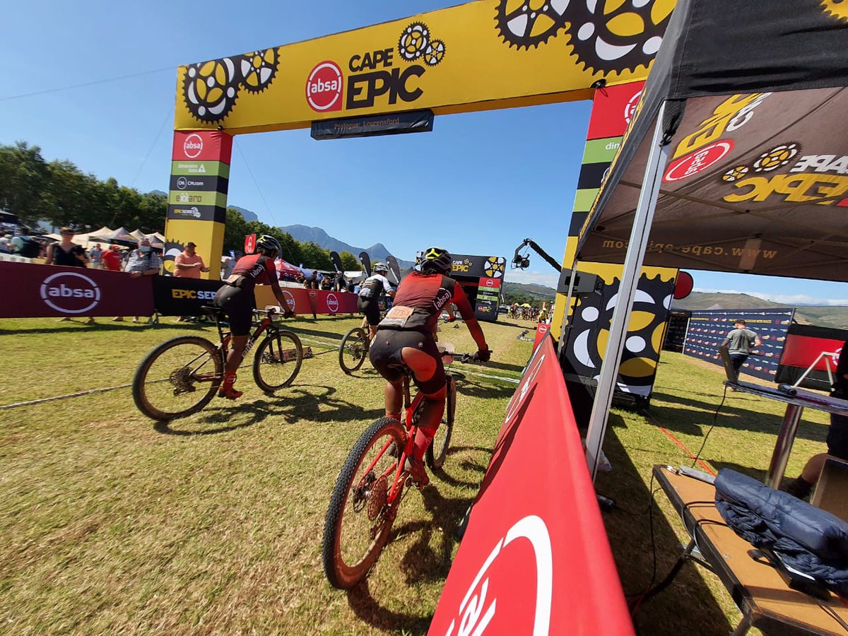 stadio_HigherEd's tweet photo. Prologue done! Beauty and Remofilwe crossing the finish line at the Absa @CapeEpic #TeamSTADIO https://t.co/jaQwWn58C1