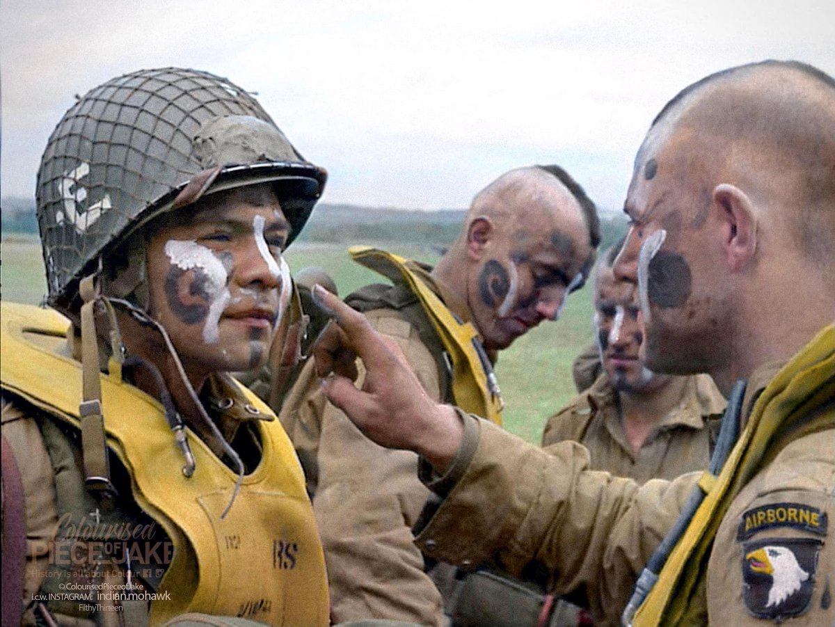 PieceJake's tweet photo. Jake McNiece paints the face of #MarianoFerra C-Comp #326thAEB just before boarding for #Normandy. June 5th, 1944, #Exeter, UK.
Ferra jumped over Normandy with the #FilthyThirteen.
He died December 23, 1944 in Bastogne. #101stairborne #ww2 #mohawk #airborne #demolitionsquad https://t.co/6ucjB9W7BY