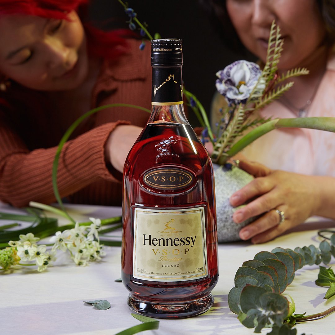 Hennessy's tweet photo. This month, we celebrate the many perspectives that come to every table. Pull up a seat. #WomensHistoryMonth #MorebyMany #HennessyVSOP https://t.co/0bGxu6M8aD