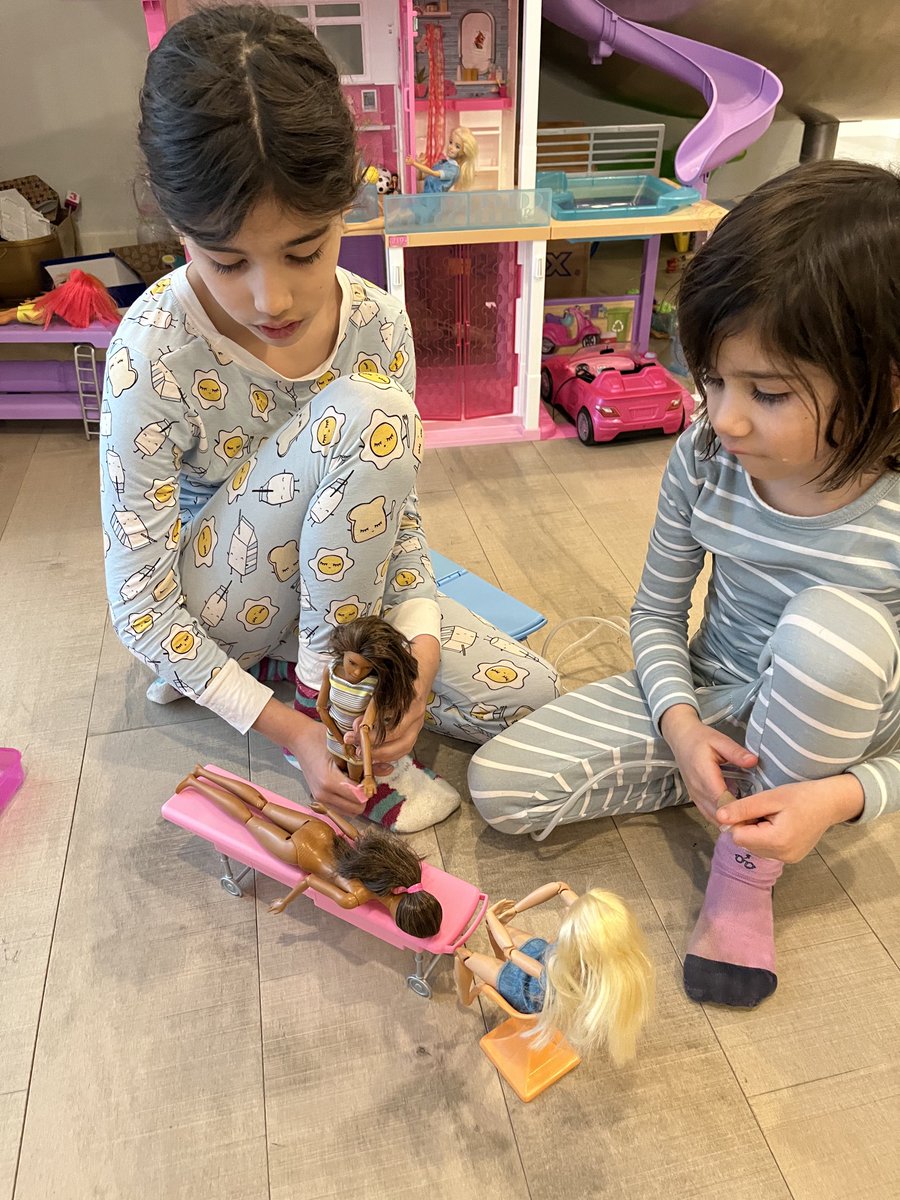 DrSamadani's tweet photo. My nieces are playing with @Barbie dolls. The prone one is having a spine tumor removed. The one in blue is the anesthesiologist and the spine surgeon (me) is in the dress. #ilooklikeasurgeon #womeninstem https://t.co/c6ZtpR6hMX