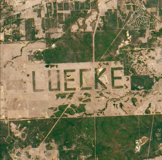 Rainmaker1973's tweet photo. In the 1990s, a Texas farmer cleared several miles of brush on his land to spell out his last name in letters so large that they are visible in satellite photos. Then, NASA used the large linear letters to calibrate satellite cameras aboard space shuttles https://t.co/bk5t7fxIcH https://t.co/WzaUTBYqee
