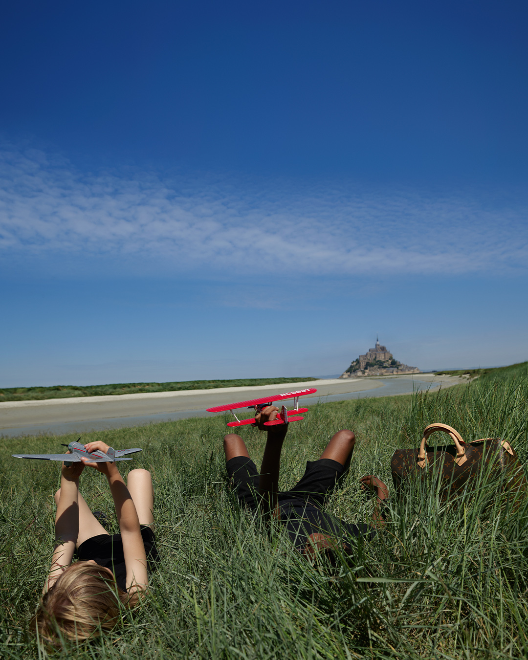 Louis Vuitton on X: The freedom of play. As if in a reverie, one's  imagination takes flight as silhouettes of children emerge from the richly  contrasting landscape of Mont Saint-Michel. Discover the