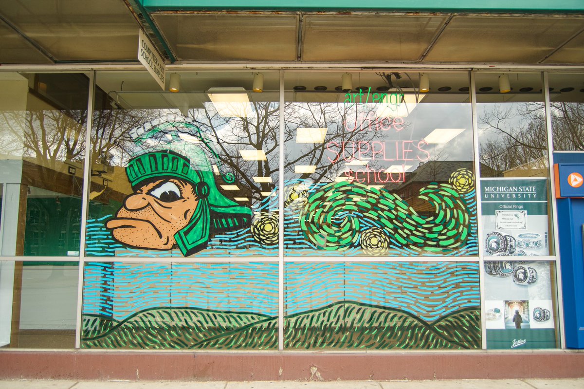 DowntownEL's tweet photo. We can’t get over this @michiganstateu inspired window art at Student Book Store! 🤩

This art piece was painted by @sbsmsu employee, Holly. Holly painted these MSU landmarks from the inside of the store— meaning she painted them all in reverse! Awesome job! 👏 https://t.co/rc2VogNUbm