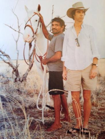BernardZuel's tweet photo. This photo, which Nick Cave reposted on his The Red Hand Files site today, is still the greatest Cave photo ever. The hat. The shorts. The sandals. The legs! https://t.co/LtJo8WnkX8