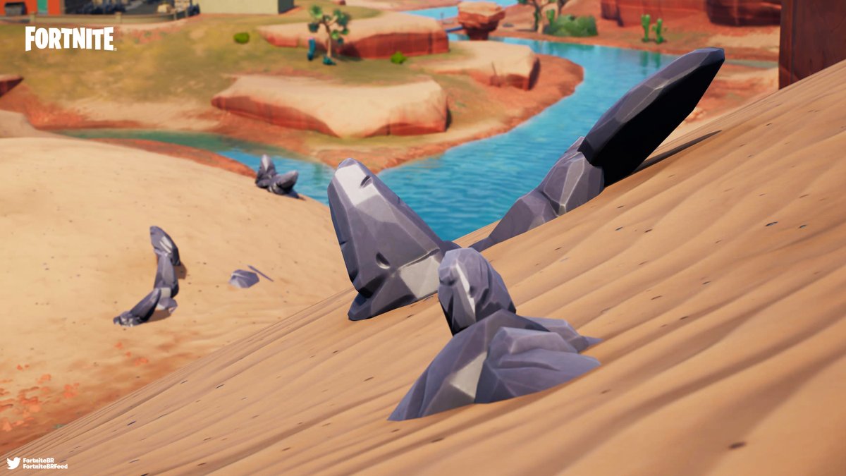 FortniteBR's tweet photo. The Rock Family from Chapter 1 can be found buried under the sand near Condo Canyon!

They moved around the Island every week during Season 7 - Season X. #Fortnite https://t.co/IMz7eEuqcE
