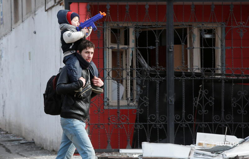 Reuters's tweet photo. Ukraine rejects Russian calls to surrender the port city of Mariupol, where residents are besieged with little food, water and power in a humanitarian crisis that is increasing pressure on European leaders to toughen sanctions on Moscow https://t.co/mf28SmNFZt https://t.co/XI9NqA11Wg