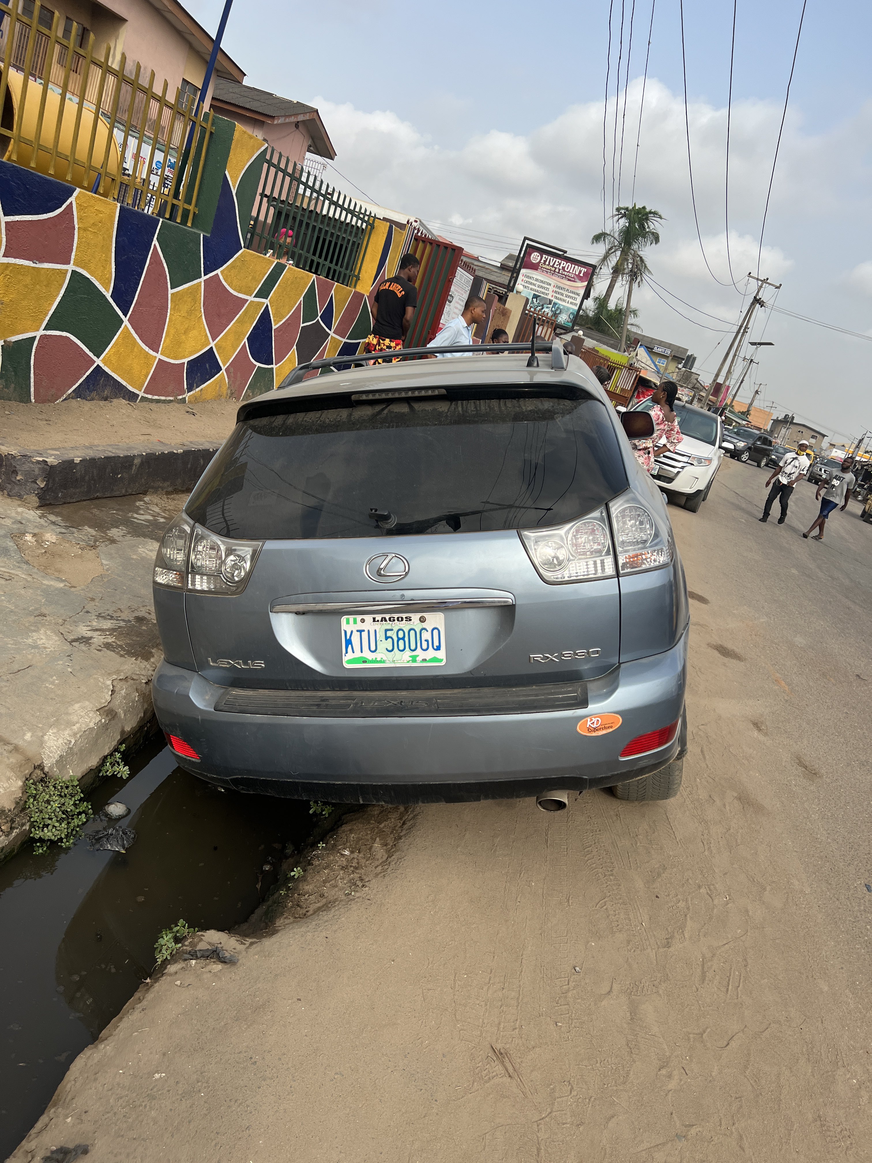 Nigerian reacts, after a man claimed his wife packed to drop the kids at school, came out and and saw the car inside gutter.
