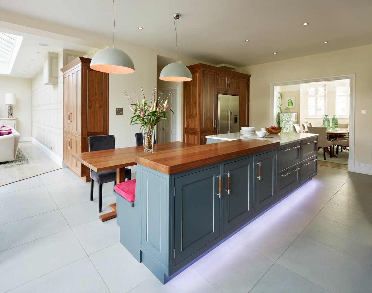 Kitchen island designed & installed by our team for a family in West London. The walnut and Caesarstone worktop is a perfect match for this kitchen. Along with a seating area for all the family & a large American fridge freezer.

#kitchenisland #luxuryinteriors #familykitchen