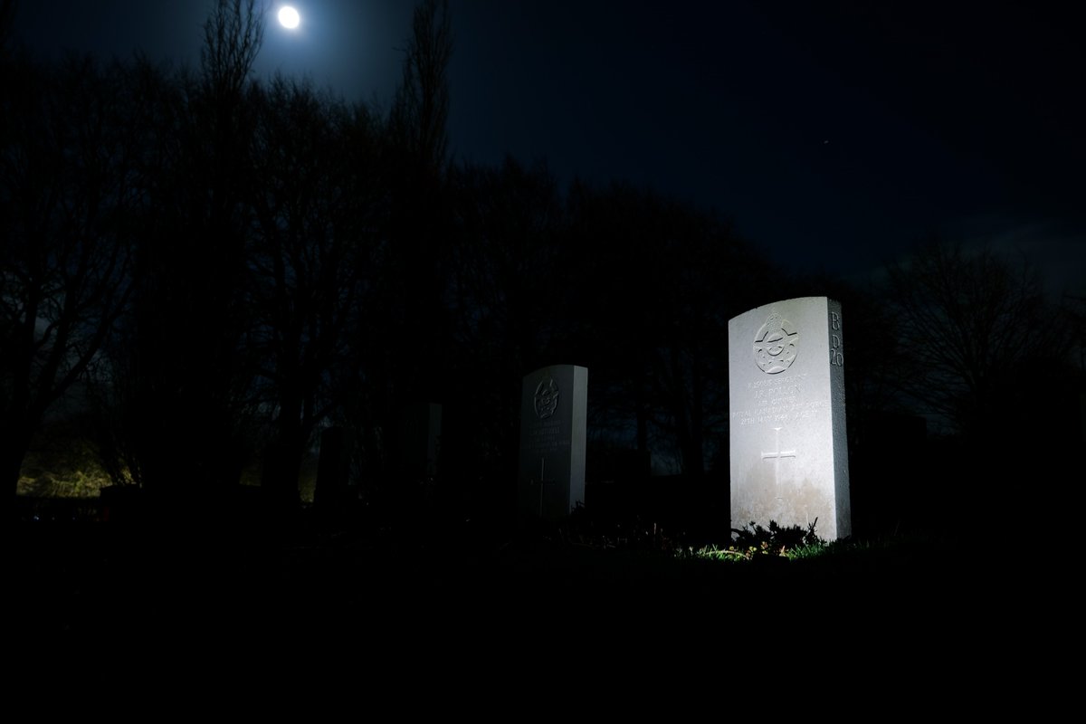 Exploring <a href="/CWGC/">Commonwealth War Graves</a>'s Harrogate Stonefall Cemetery by moonlight with <a href="/scott_smith9/">Scott Smith</a> last week. Lit up the headstone of Sergeant J.R. Pollon, one of the youngest casualties buried in the cemetery. #WeAreCWGC