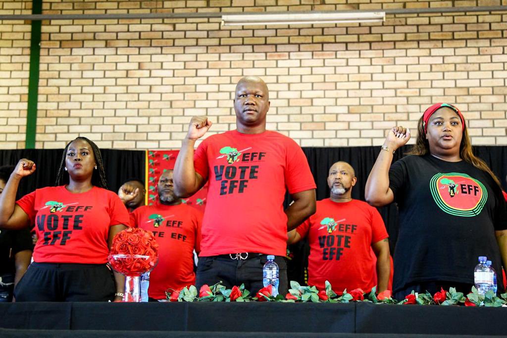 EFFSouthAfrica's tweet photo. [In Pictures]: Singing of the National Anthem void of Die Stem, at Thanduxolo Hall in Uitenhage today.

The government of terror opened fire on this day in 1985, killing our people in Uitenhage. #EFFUitenhageDay https://t.co/T0wPGrlNNG