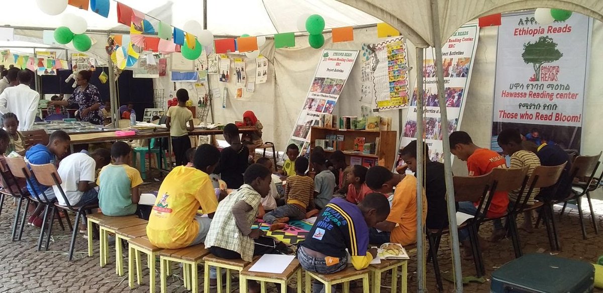 EthiopiaReads's tweet photo. Our #Hawassa Reading Center joined National Archives & Library Agency's "Book Week” fair for 5 days in the southern town of #Dilla 100s of children & parents dived into in reading, games and arts. Our "pop-up" outdoor tent library had plenty of books! #SNNPR #ThoseWhoReadBloom https://t.co/O8olg1rrBZ