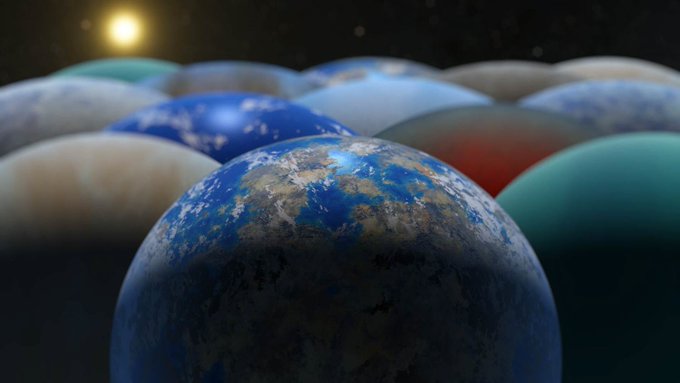 An artist's illustration of exoplanets of varying colors and sizes, including an Earth-like world in the center of the front row. Image credit: NASA/JPL-Caltech/Keith Miller (IPAC)