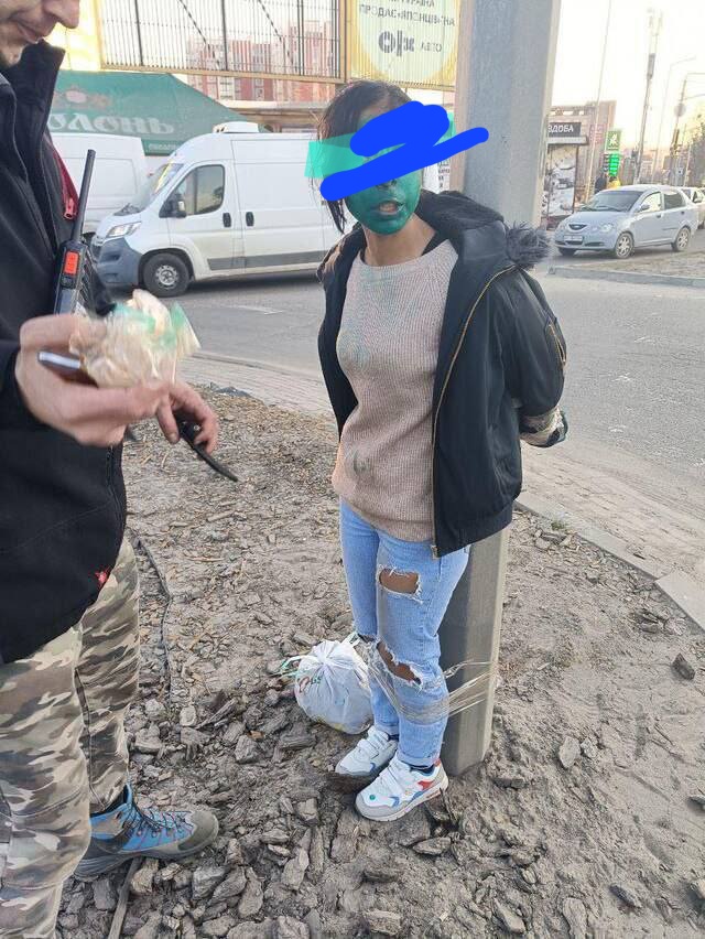 JeremyTheGun's tweet photo. CW: woman tied to a pole.

The green paint signifys Russian speaker. They call the Russians Orcs hence the green paint. You won't see this on western msm. https://t.co/pGUIhfcAAy