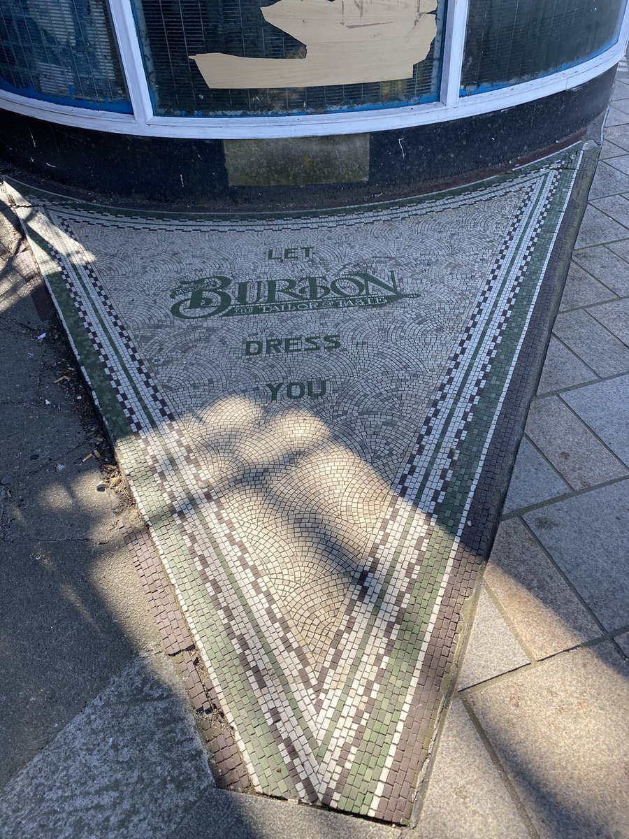 BhsMuralHull's tweet photo. For #tilesontuesday this lovely clipped #doorstep #mosaic at the back of the #Burtons #store in #Hull. Caught last Thursday morning on a gloriously sunny day. The building itself is a smasher too 🖤💚🤍 https://t.co/2uj7y9MSRb