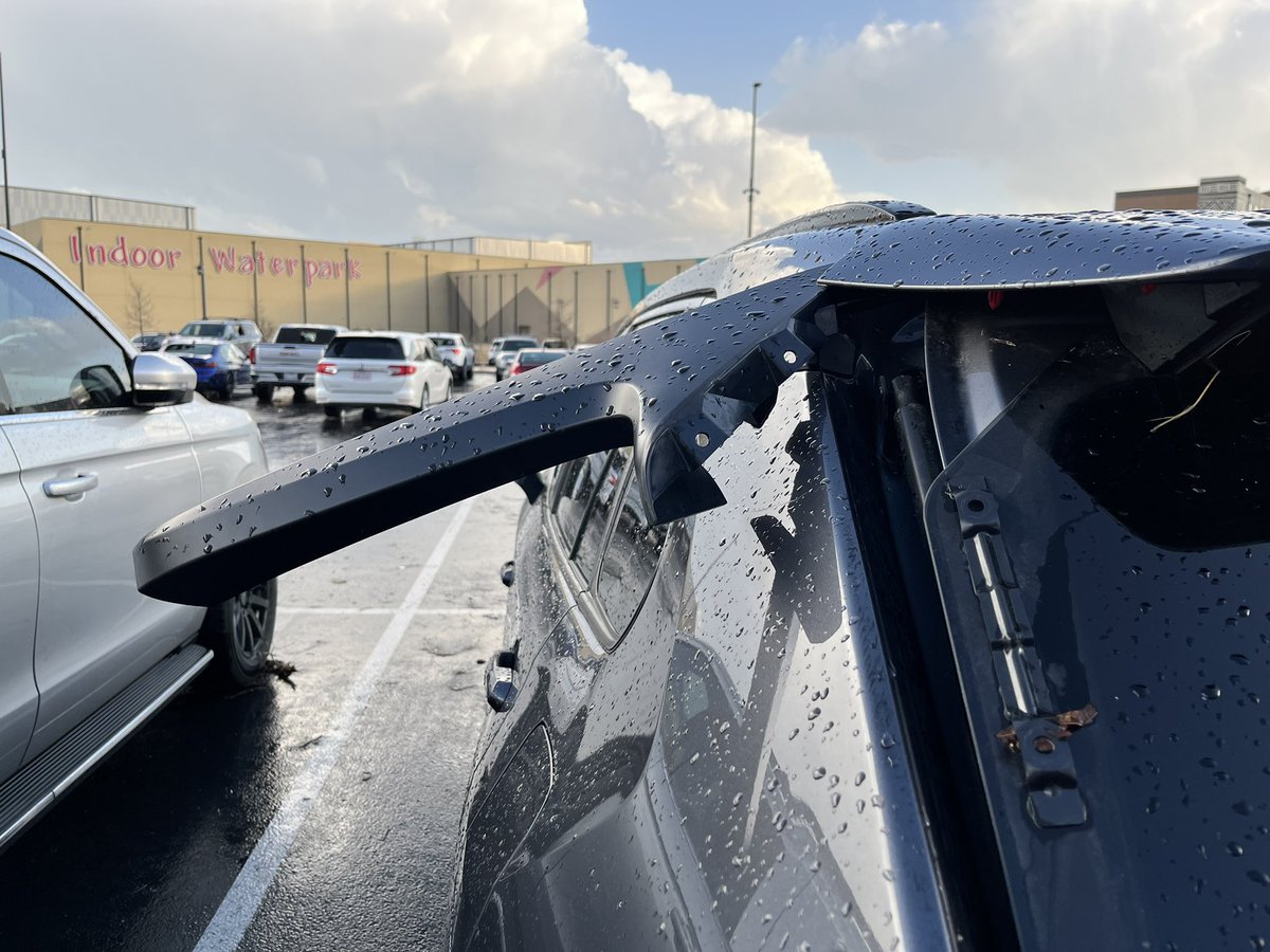 MikeMarut_'s tweet photo. More damage: windows blown out, a car popped up on the curb, roofing underneath cars in the parking lot here at Kalahari. @KVUE https://t.co/TrD3Mwkj3p
