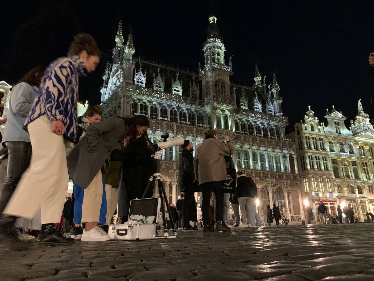 PhillyMoonMen's tweet photo. If you looked up from this spot 150 years ago, you would see the Milky Way. Today, we only have the moon.

150 people joined us in Grand Place from 14 different countries. More than 100 of them had never looked through a telescope before. https://t.co/P2KeEpl0Ia