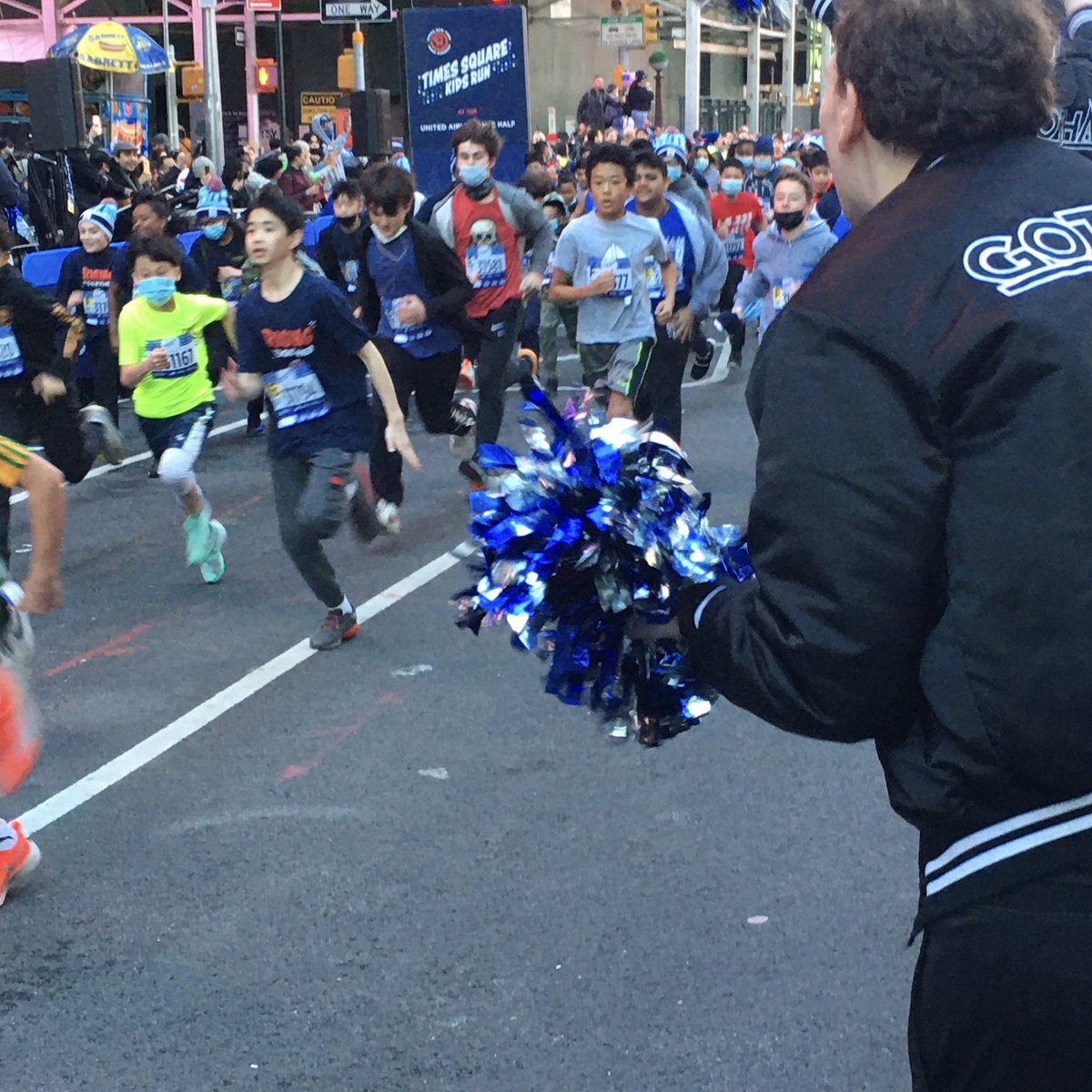GothamCheer's tweet photo. #Cheering hundreds of the #RisingNYRR in #TimesSquare, as part of the #UnitedNYCHalf on Sunday! #NYRR #GothamCheer #Inspire #NYCHalf #Youth #NYC #iloveny https://t.co/qYzviQMXLH
