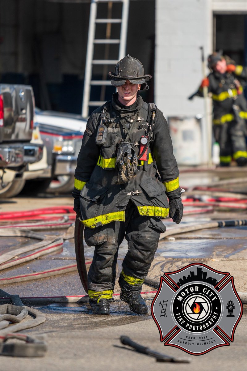 Detroit Engine 42 Firefighter picking up line after a fire in a commercial building. 
Plymouth &amp; Ashton 
3/21/22