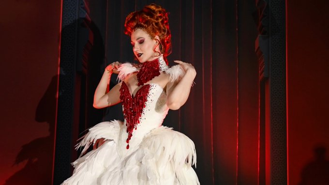 1 pic. One of my favorite acts of the Queen of Hearts show. I had this corset and feather dress custom