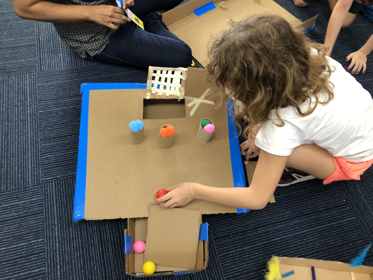 AISCElementary's tweet image. #AISCGrade2 students working on #AISCSocialStudies as they get ready for marketplace. #AISCLearner