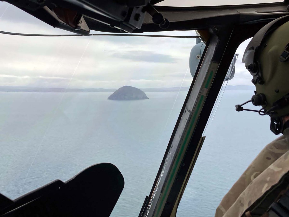 Merlin Mk2 helciopter of 824 NAS passing the Ailsa Craig enroute to a training mission