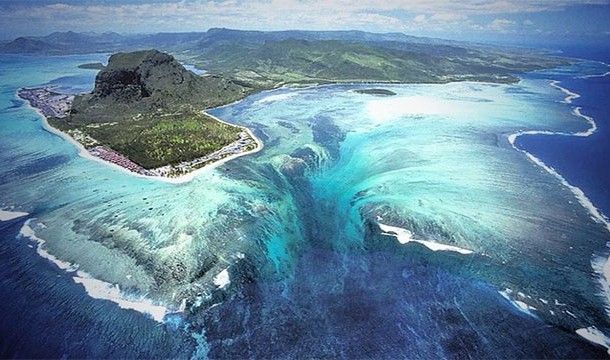Sand sucked down into the depths creates the illusion of an 'underwater waterfall' in Mauritius.